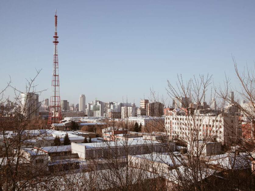 pexels-photo-6616219 Modern buildings and transmission tower in city